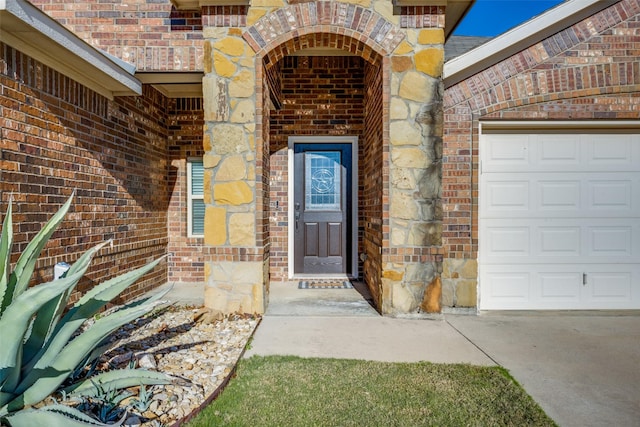 doorway to property featuring a garage