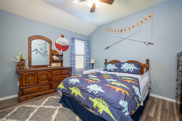 bedroom with dark wood-type flooring, ceiling fan, and lofted ceiling