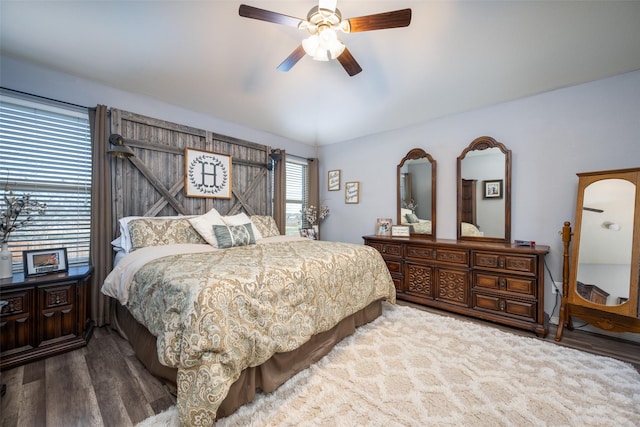 bedroom with hardwood / wood-style floors and ceiling fan