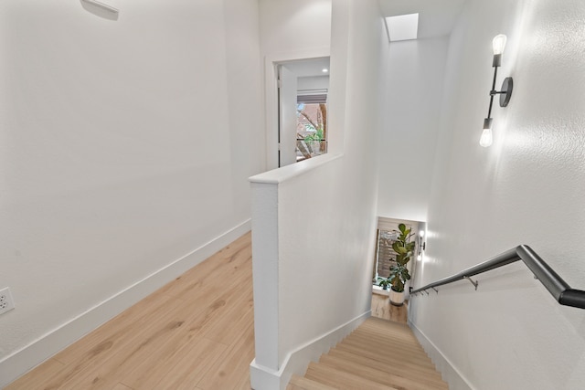 staircase featuring hardwood / wood-style flooring