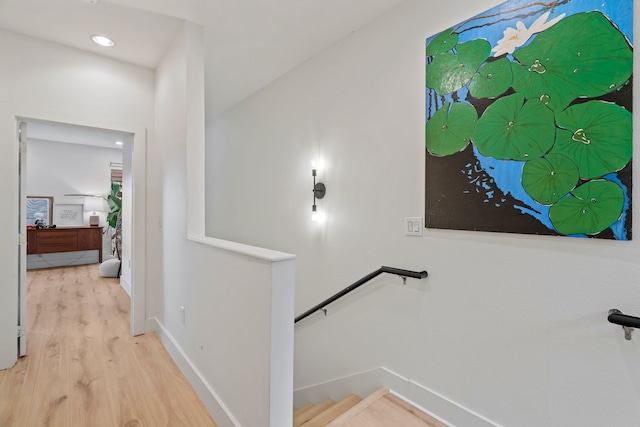 staircase featuring hardwood / wood-style floors