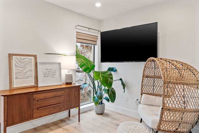 sitting room with light hardwood / wood-style floors