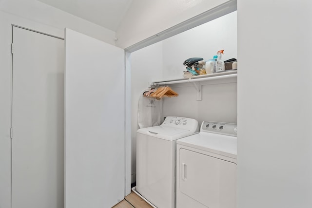 clothes washing area with washer and dryer