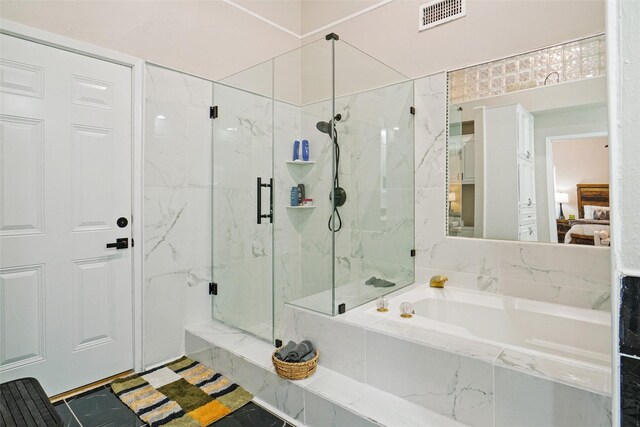 bathroom featuring separate shower and tub