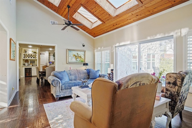 living room with a skylight, ceiling fan, dark wood-type flooring, wooden ceiling, and high vaulted ceiling