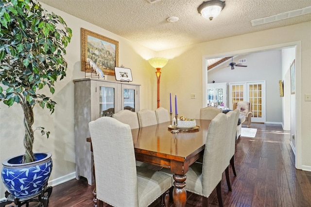 dining space with a textured ceiling, ceiling fan, dark wood-type flooring, and french doors