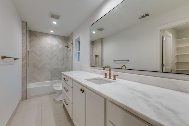 full bathroom with toilet, vanity, tile patterned floors, and tiled shower / bath combo