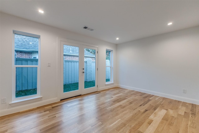 interior space with french doors and light wood-type flooring