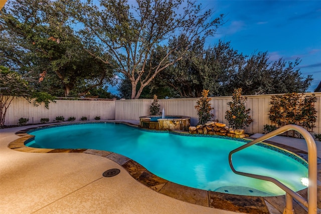 view of swimming pool with an in ground hot tub and a patio