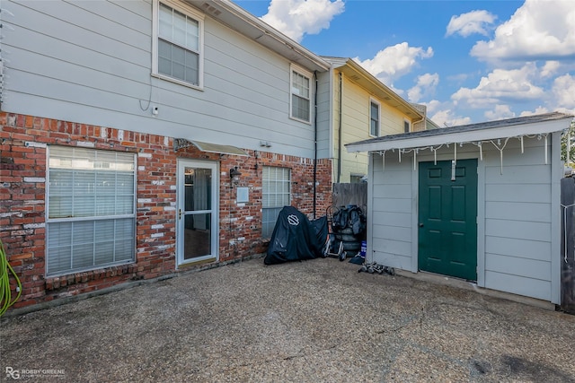 back of property featuring a patio area