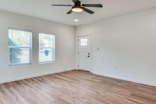 entrance foyer with ceiling fan and light hardwood / wood-style floors