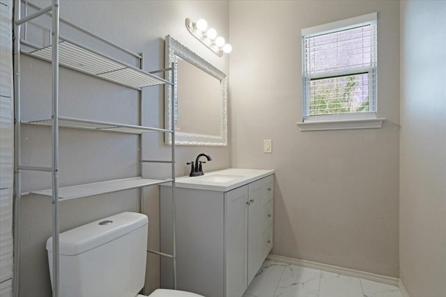 bathroom featuring vanity and toilet