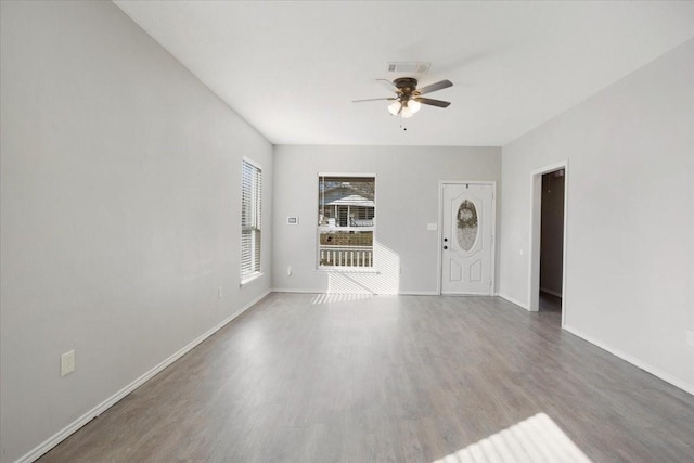 interior space featuring wood-type flooring and ceiling fan