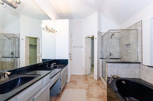 bathroom featuring tile patterned flooring, vanity, and separate shower and tub