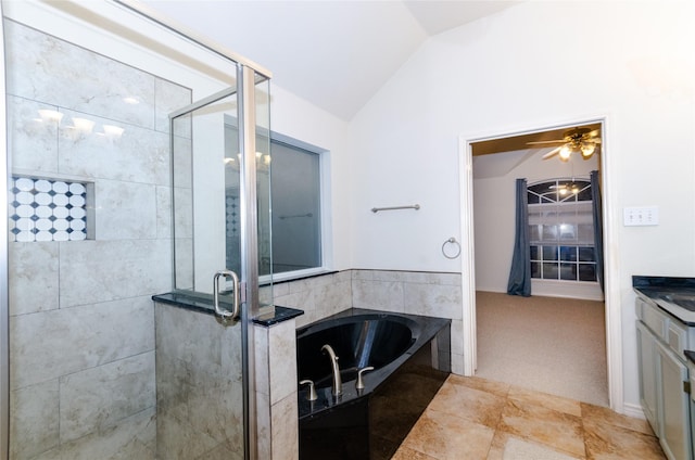 bathroom with vanity, separate shower and tub, vaulted ceiling, and ceiling fan