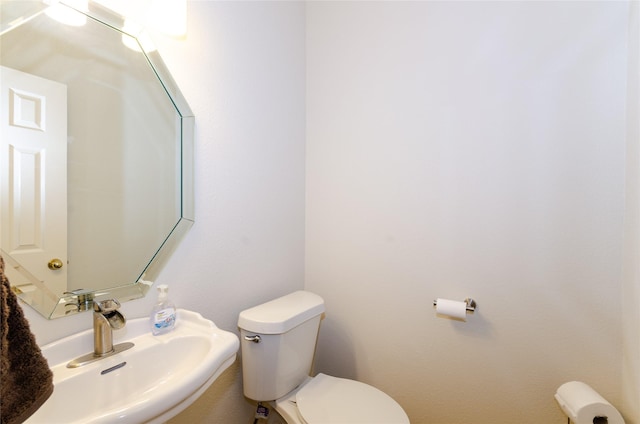 bathroom with toilet and sink