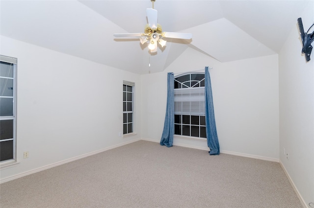 interior space with light carpet, ceiling fan, and vaulted ceiling