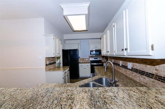 kitchen with stainless steel appliances, white cabinetry, and tasteful backsplash