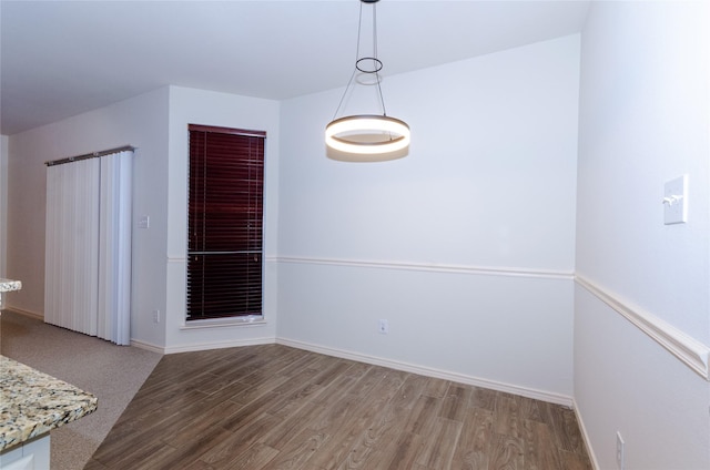 unfurnished dining area with light wood-type flooring