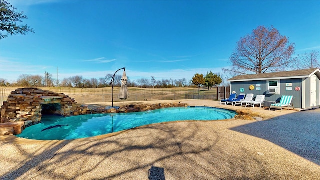 view of pool with an outbuilding