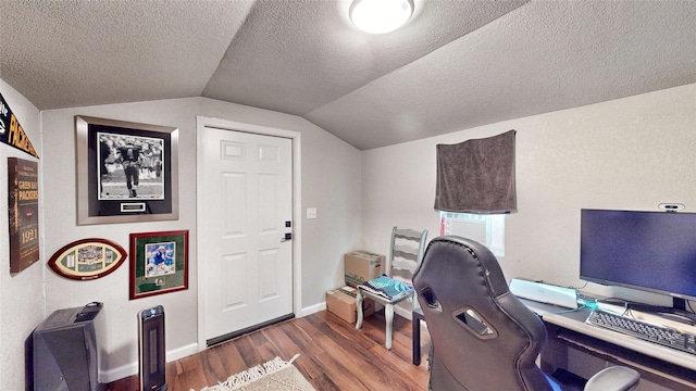 office with lofted ceiling, dark hardwood / wood-style floors, and a textured ceiling