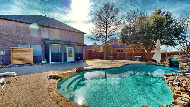 view of swimming pool with a patio