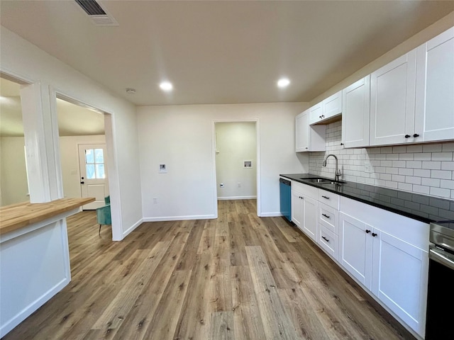 kitchen featuring sink and white cabinets