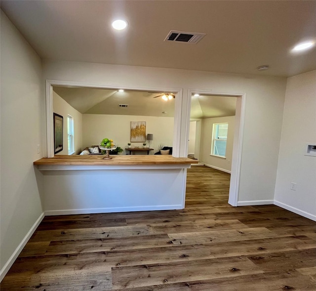 kitchen with dark hardwood / wood-style floors and kitchen peninsula