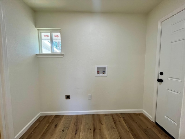 laundry area with electric dryer hookup, dark wood-type flooring, and washer hookup