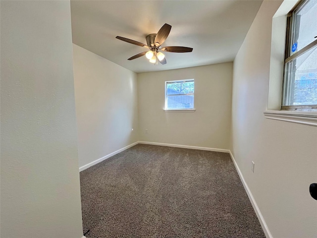 carpeted empty room featuring ceiling fan