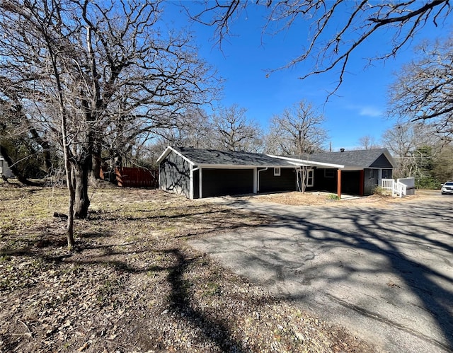 view of side of property with a garage