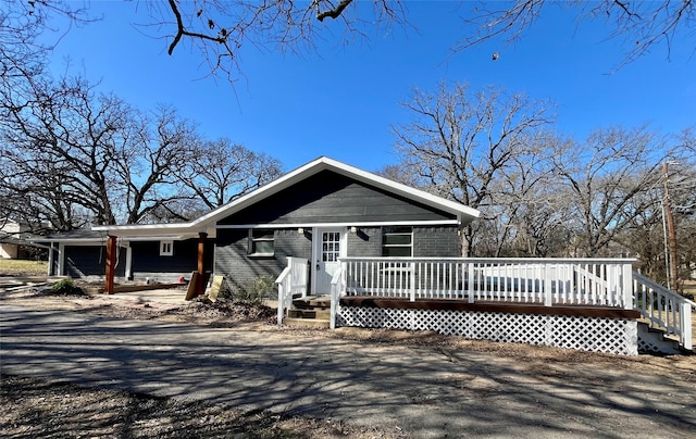 view of front of property with a wooden deck