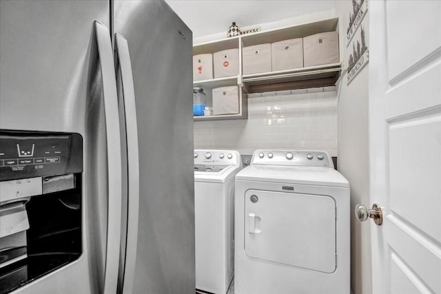 laundry room featuring separate washer and dryer