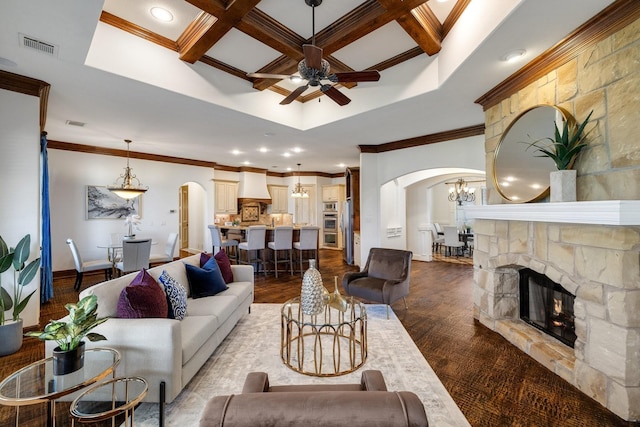 living room featuring hardwood / wood-style flooring, ornamental molding, and coffered ceiling