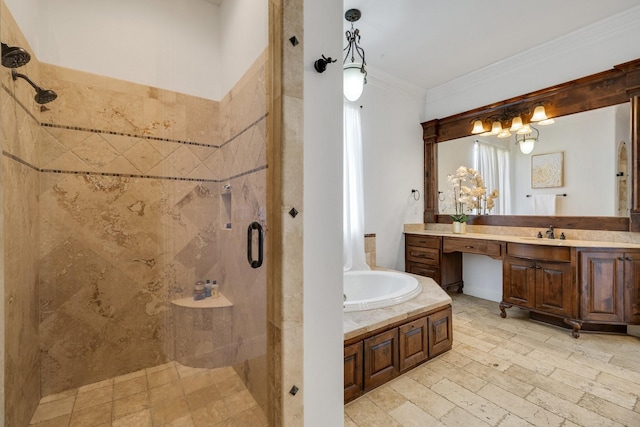 bathroom with independent shower and bath, ornamental molding, and vanity