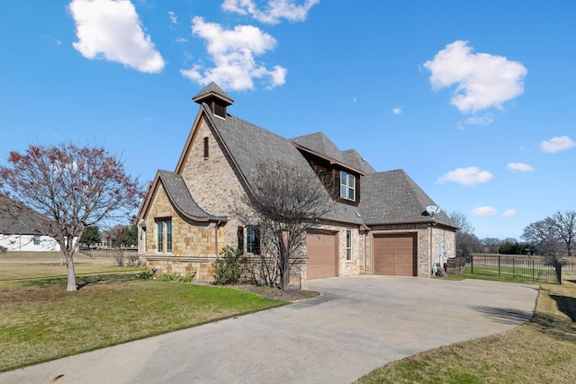 view of front facade featuring a garage and a front lawn