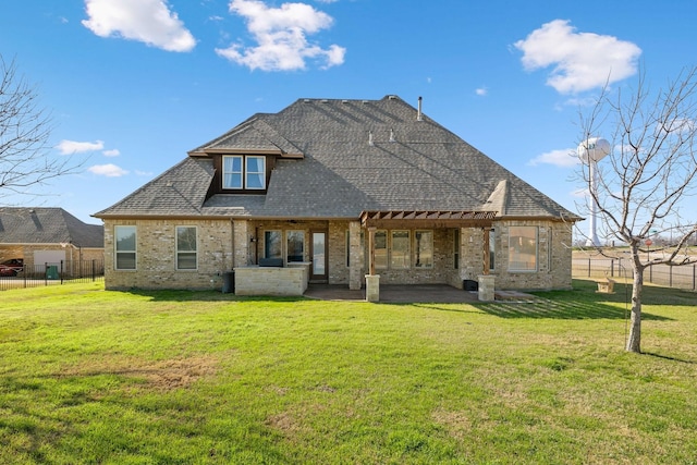 rear view of house featuring a yard and a patio