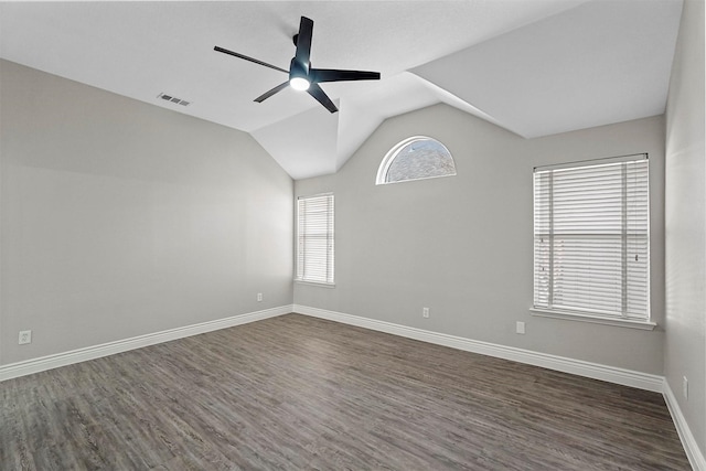 unfurnished room with dark wood-type flooring, ceiling fan, and lofted ceiling