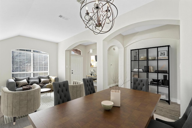 dining space with an inviting chandelier