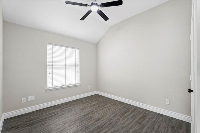 spare room with ceiling fan, dark hardwood / wood-style flooring, and vaulted ceiling