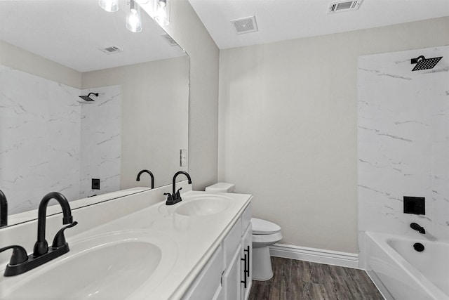 full bathroom featuring vanity, shower / bathtub combination, toilet, and wood-type flooring