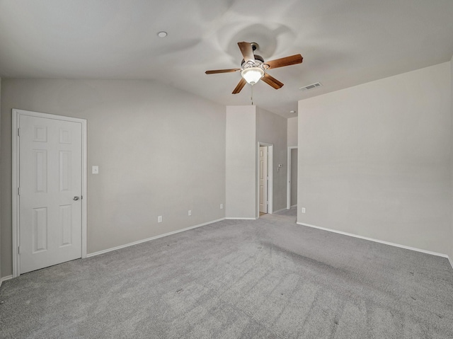 empty room with ceiling fan, light carpet, and lofted ceiling