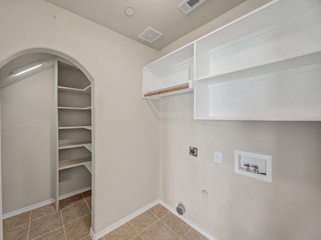 washroom with washer hookup, gas dryer hookup, electric dryer hookup, and tile patterned flooring