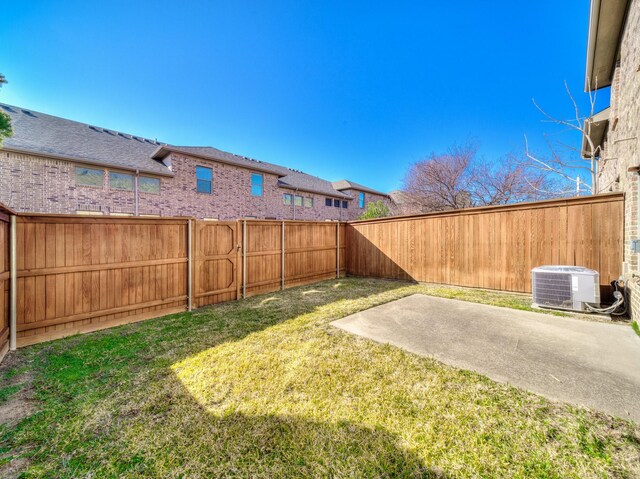 view of yard with a patio area and central air condition unit