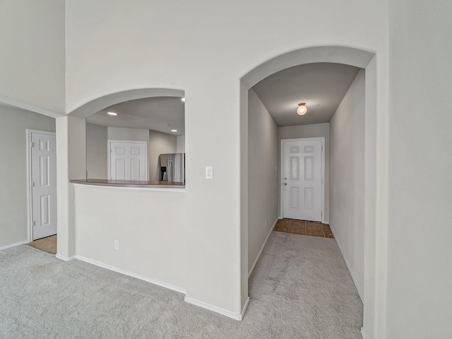 hallway with light carpet