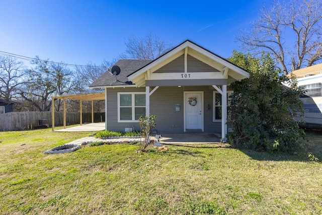 bungalow-style house featuring a front yard