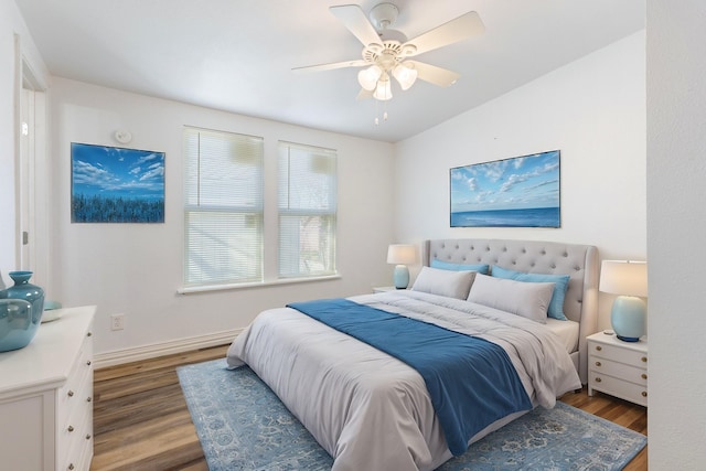 bedroom with dark wood-type flooring and ceiling fan