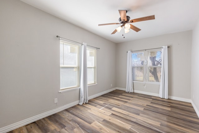 unfurnished room with hardwood / wood-style floors and ceiling fan