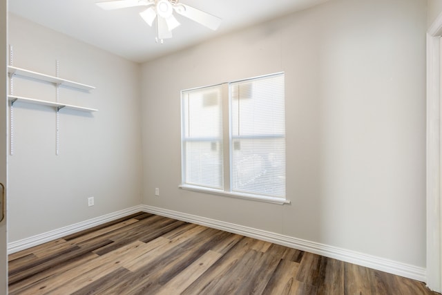 spare room featuring wood-type flooring and ceiling fan