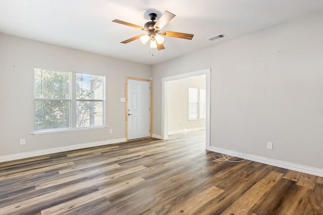 empty room featuring dark hardwood / wood-style floors and ceiling fan